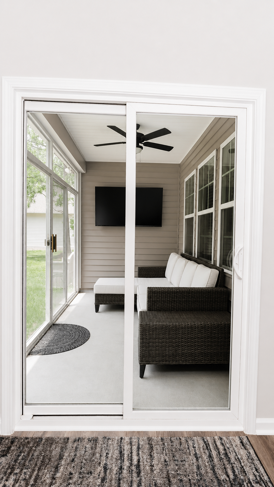 Covered back porch viewed from inside the breakfast area