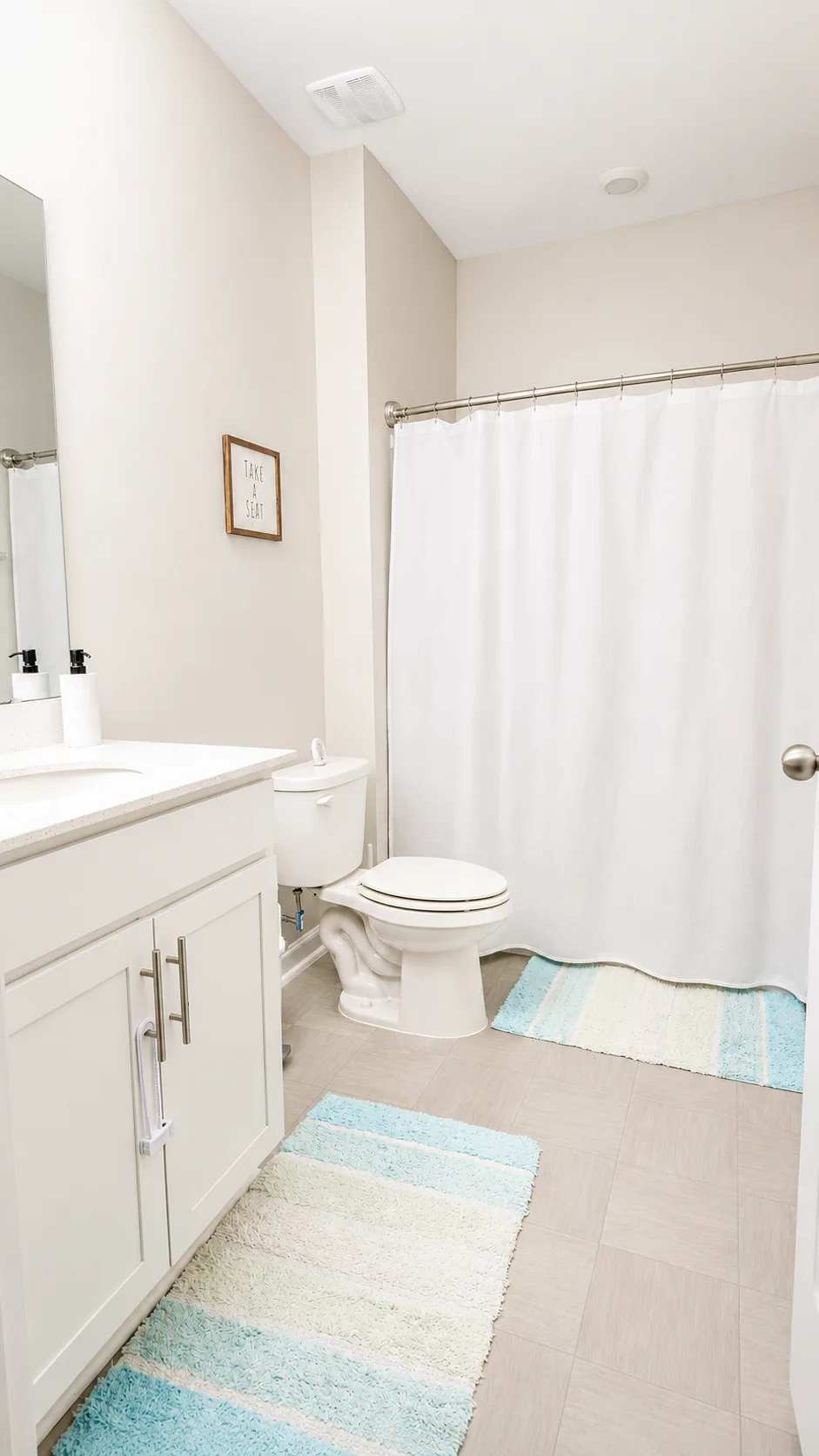 Full bathroom at 222 Lothian with vanity, tile floor and shower
