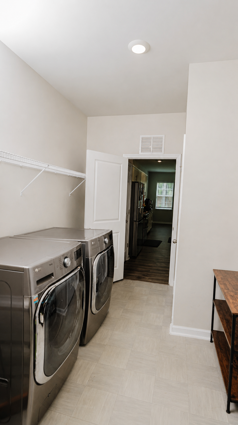 Laundry room with full-size washer and dryer