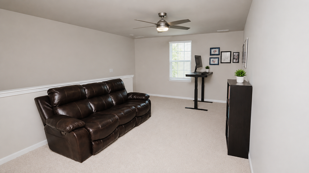 Bonus room with leather recliner sofa, ceiling fan and natural light